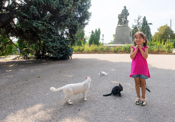 Little girl and cats..