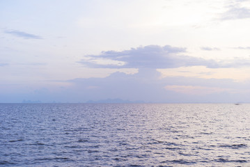 Obraz premium Seascape with sunset blue sky. Sunlight on water.