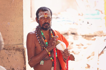 Indian Sadhu holding the conch