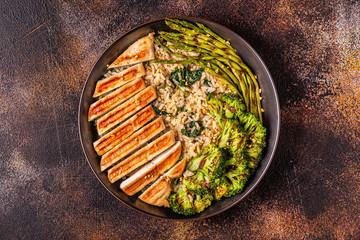Grilled chicken breast with brown rice, spinach, broccoli, asparagus