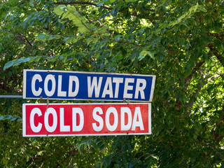 Street vendor's cold water, cold soda sign on display outdoors