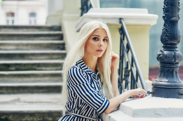 portrait of blonde girl in the city