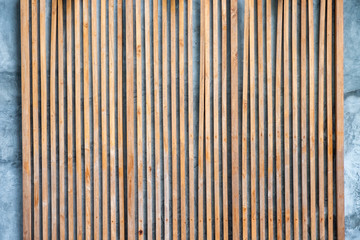 Modern wooden brown lath decoration on facade