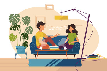 Couple of guy and girl sitting on couch at home
