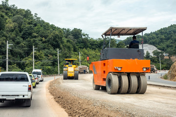 Road construction repairing with compactors