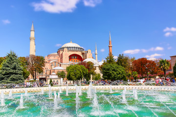 Hagia Sophia Ayasofya museum with fountain in the Sultan Ahmet Park in Istanbul, Turkey during sunny summer day.