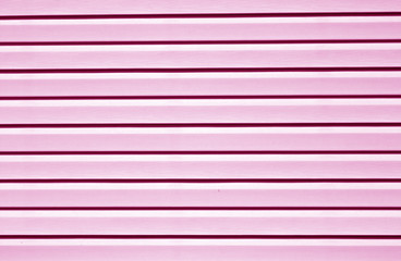 Plastic siding surface in pink tone.