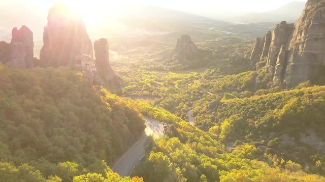 Drone Flight through the Meteora Sandstone Mountains in Greece at sunset