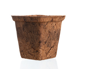 Empty flowerpot made from coconut fiber isolated a on white