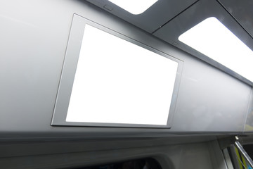 A blank lighted signboard inside a high speed train, with space for text.