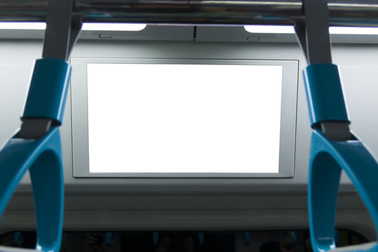 A blank lighted signboard inside a high speed train, with space for text.
