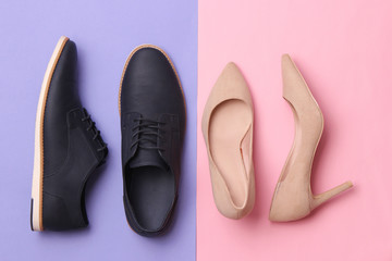 modern fashionable classic shoes, men's and women's shoes on a colored background top view.