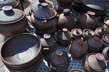 exhibition of clay pots and bowls for sale at the fair masters
