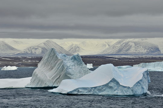A huge iceberg with textured ice structure.