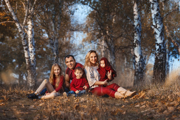 Fototapeta premium Happy family in the autumn forest