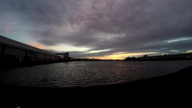timelapse of sunset over docklands