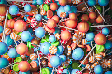 Colorful orange blue and green lollipops backdrop