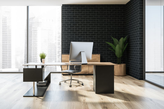 Black brick manager office with computer table