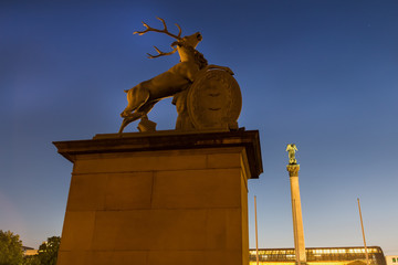 deer statue stuttgart germany at the new castle in the evening