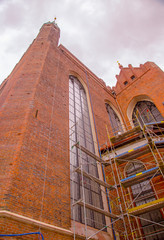 Gdansk Old City, Saint Mary Church reconstraction. wall with huge stained glass window. View from low point.