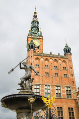 Fountain of the Neptune with Town Hall with clock in the background, Old City, Gdansk, Poland