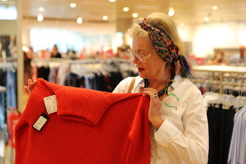 Adult daughter with her mother during shopping at Kurfürstendamm and Tauentzienstraße in Berlin-City, Germany.