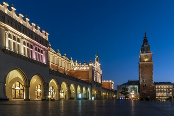 Fototapeta na wymiar Beautiful view of Cloth Hall (Sukiennice) and Tower Hall (Wieża ratuszowa w Krakowie) in the blue hour, Krakow's Old Town, Poland, main market square