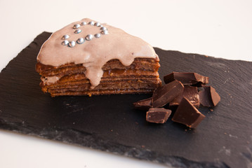 Sweet surprise for darling. Piece of chocolate cake with heart.