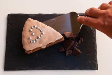 Sweet surprise for darling. Piece of chocolate cake with heart.
