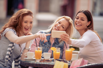 Friends having a great time in cafe