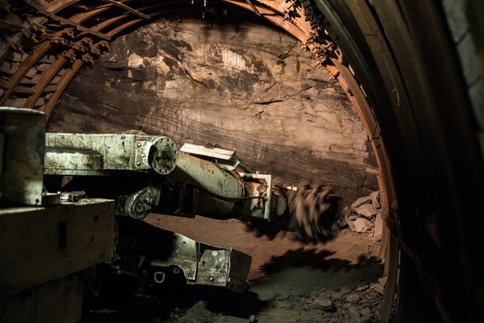 Roadheader drills the tunnel in rock