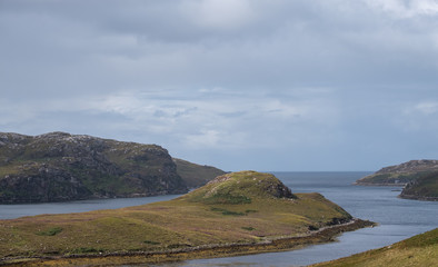 View on the North Coast 500 circular road around Scotland. Photo taken between Polbain and Lochinver in the Scottish Highlands, north west Scotland.