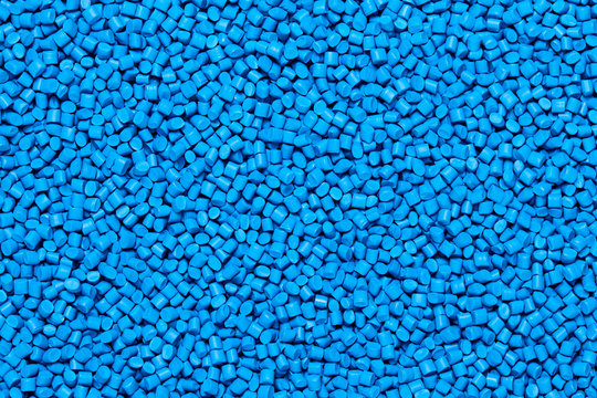 Close Up Flat Lay Of A Blue Plastic Polypropylene Granules On A Table, Copy Space