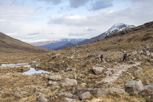 Hiking in the Scottish Highlands in Torridon along The Cape Wrath Trail towards Loch Coire Mhic Fhearchair, Highlands, Scotland