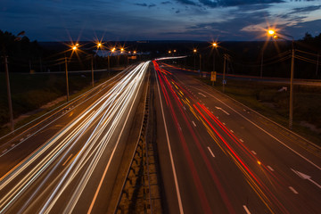 Fototapeta na wymiar Night traffic road highway with car lights