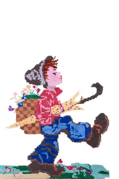 Hand embroidery painting boy traveler on a light background, handmade, hobby