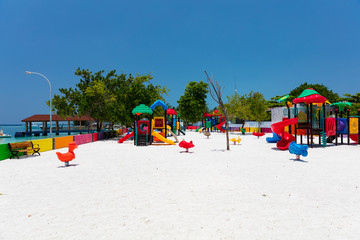 Colourful childrens playground on tropical island