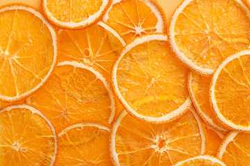 dried oranges on color paper background