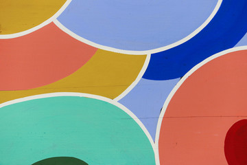 Fragment of a colorful pattern on a wooden surface