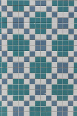 Fragment of the wall lined with fine ceramic tiles