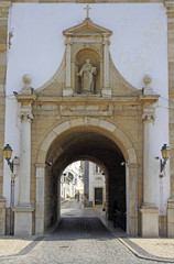 arch entrance to the old town of city Faro