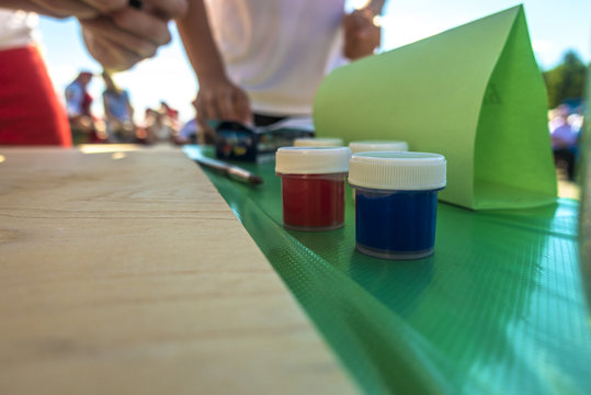 Multicolored jars with paint for drawing
