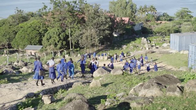 Tanzanian children, early in the morning on their way to school in Mwanza on Lake Victoria