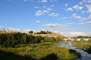 Fototapeta na wymiar view of bridge and the Castle of Henry II of Castile (14th century) and River Agueda, Ciudad Rodrigo, Castile and Leon, Spain