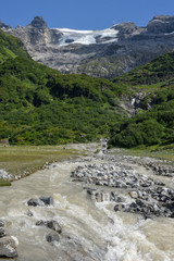 River with water from the glacier of mount Titlis over Engelberg on Switzerland