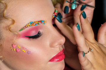 Fashion woman with creative make up. Candy make up.