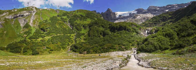 Fototapeta na wymiar River with water from the glacier of mount Titlis over Engelberg on Switzerland