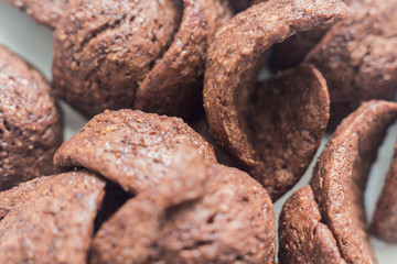 Textured background of chocolate cereals close up