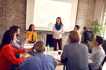 Fototapeta premium Woman reads company results on meeting