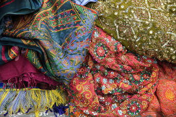 Beautiful silk fabric and embroidered with beads at the flea market. Moscow. 07.02.2018